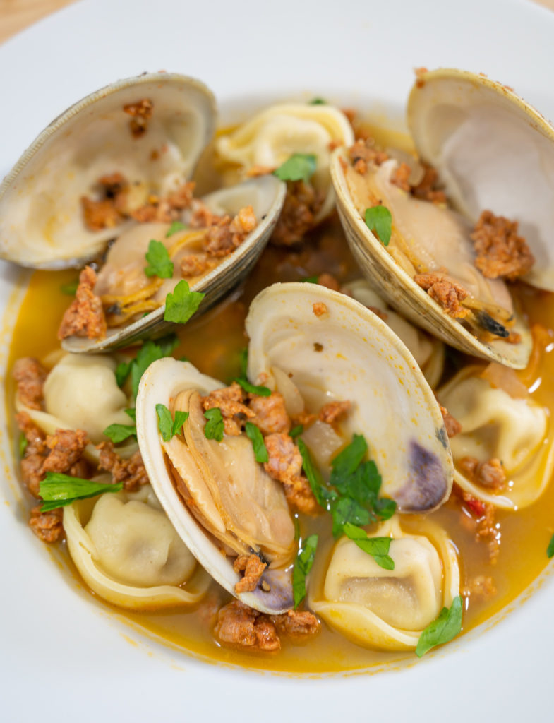 brothy clams and chorizo tortelloni